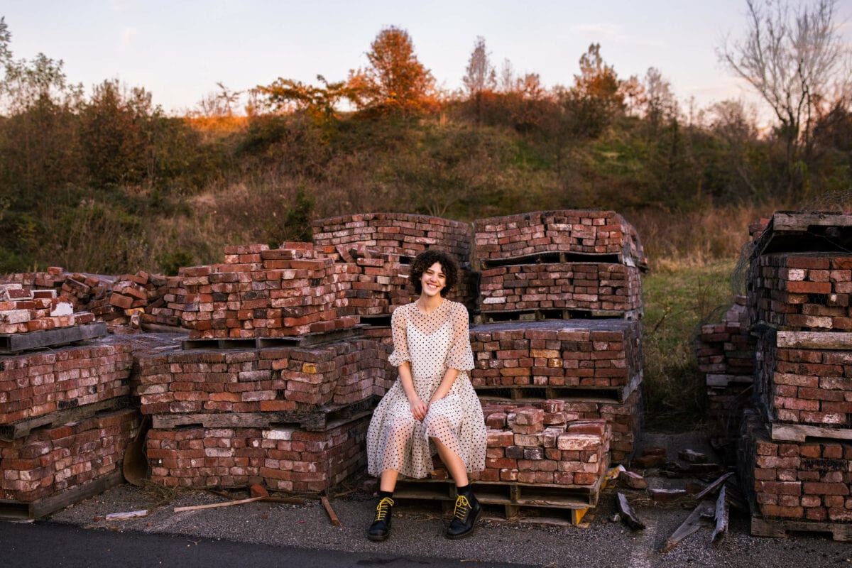 senior girl photography with brick background location