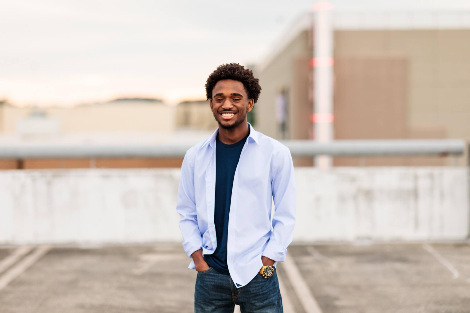 senior photography with boy at northern Virginia parking garage