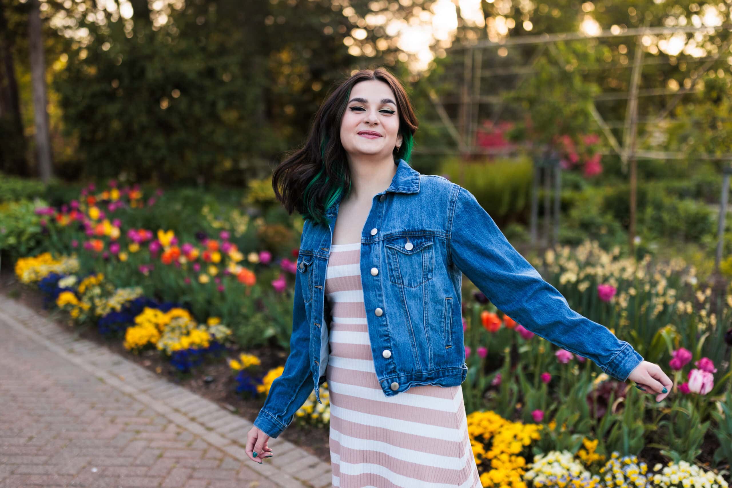 spring senior session with girl in garden with tulips