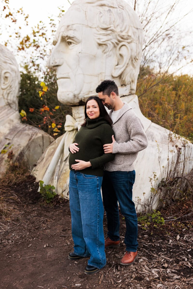 pregnant mom stands with husband outdoor photo session virginia 